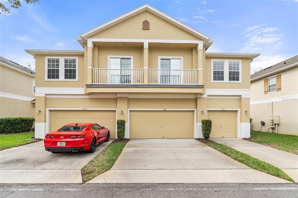 3555 Clay Brick Road, Unit 46A Harmony, FL 34773 - Photo 24 of 54 a front view of a house with a garden and parking space
