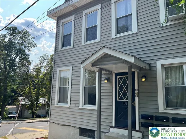 a front view of a house with parking