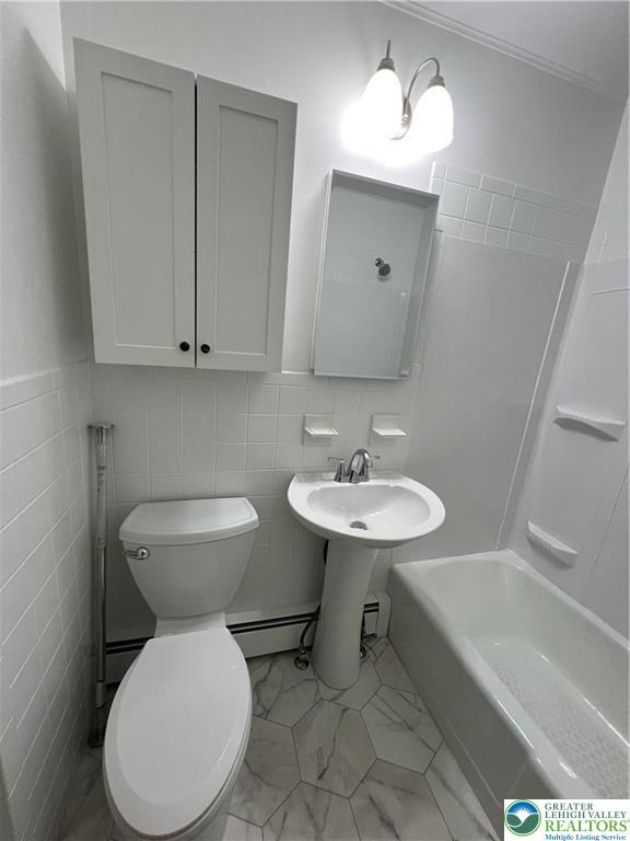 101 Center Street, Unit 1A Jim Thorpe, PA 18229 - Photo 13 of 18 a bathroom with a toilet sink and mirror