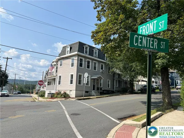 a street sign on a pole on a street