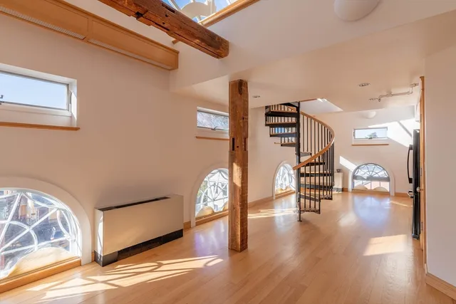 a view of an entryway with wooden floor