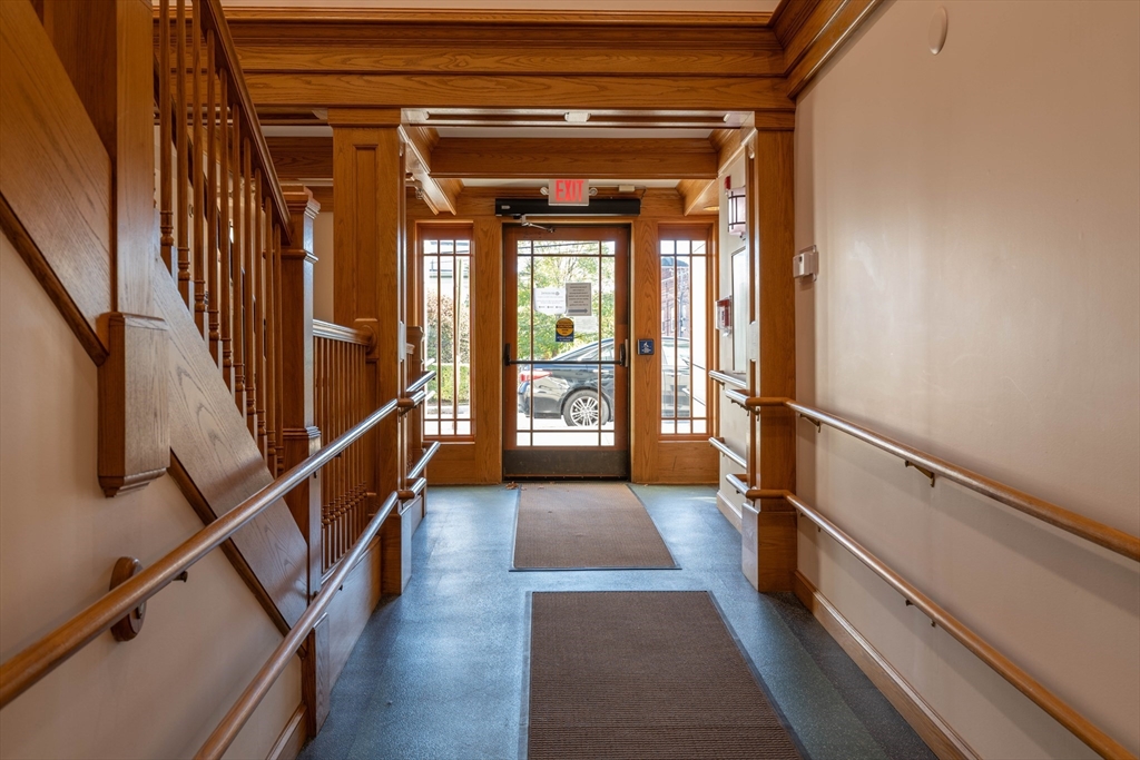 43 Center Street, Unit K Northampton, MA 01060 - Photo 12 of 18 a view of entryway with wooden floor and stairs