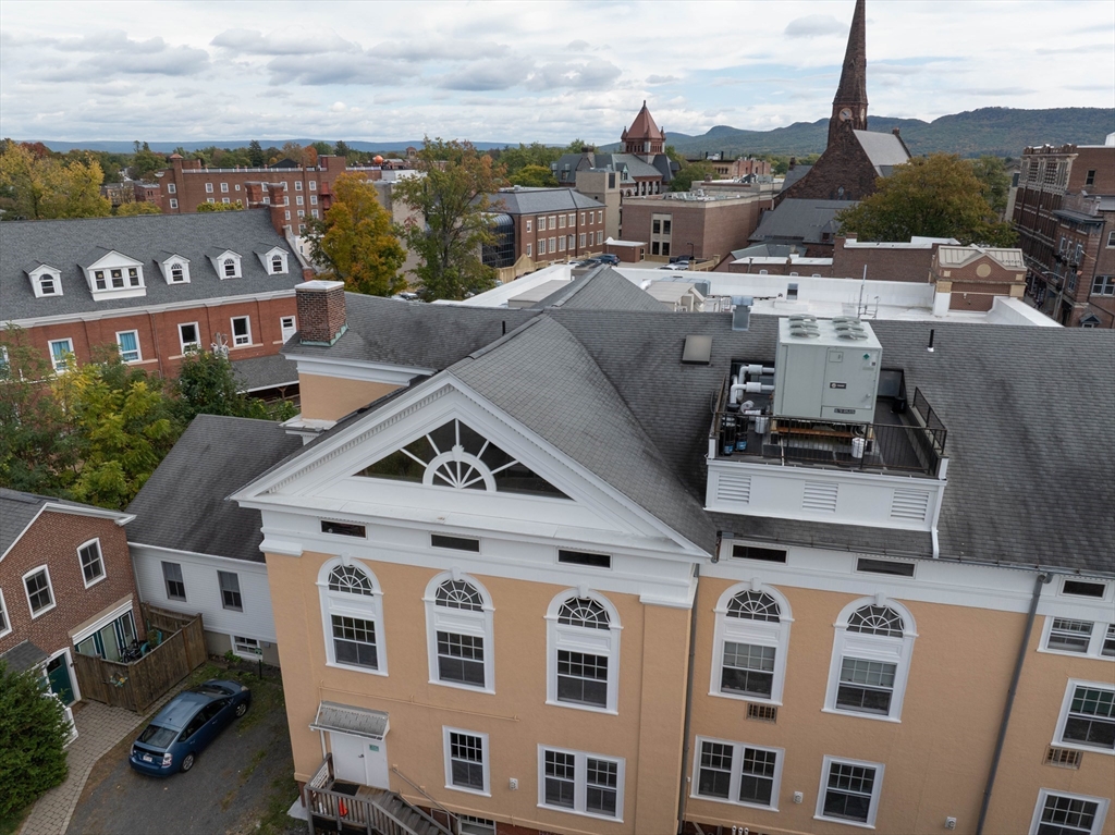 43 Center Street, Unit K Northampton, MA 01060 - Photo 14 of 18 a view of a city with tall buildings