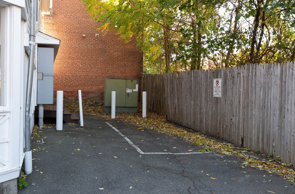 43 Center Street, Unit K Northampton, MA 01060 - Photo 18 of 18 a view of a outdoor space with wooden fence