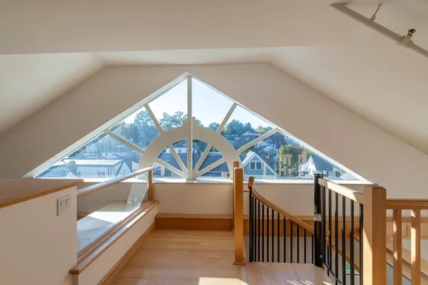 a view of an entryway with wooden floor