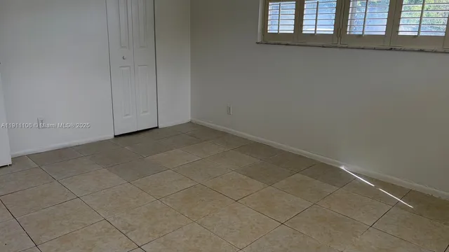 a view of an empty room and window