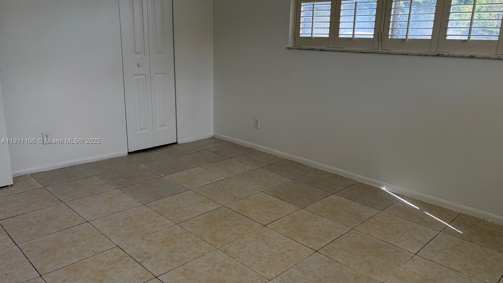 7925 Fairview Drive, Unit 110 Tamarac, FL 33321 - Photo 20 of 34 a view of an empty room and window