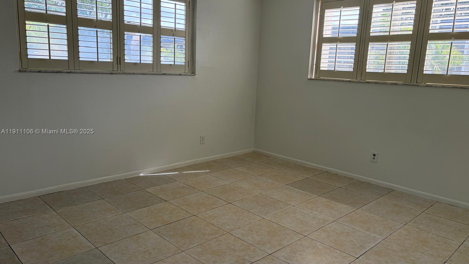 7925 Fairview Drive, Unit 110 Tamarac, FL 33321 - Photo 24 of 34 an empty room with a window