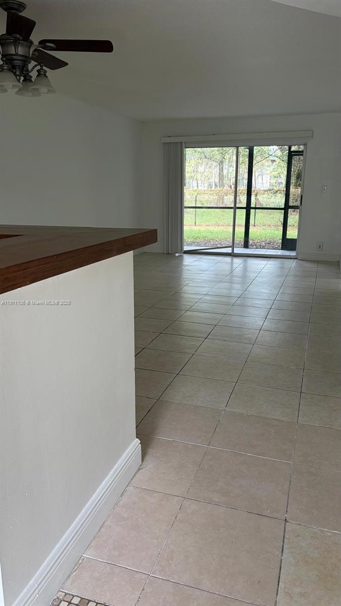 7925 Fairview Drive, Unit 110 Tamarac, FL 33321 - Photo 3 of 34 an empty room with large window