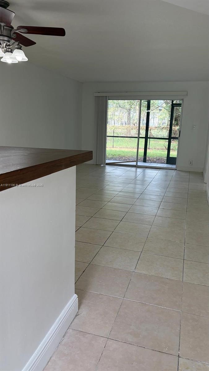 7925 Fairview Drive, Unit 110 Tamarac, FL 33321 - Photo 6 of 34 a view of an empty room with a window