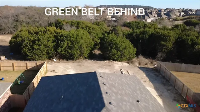 a view of outdoor space with signage and flags