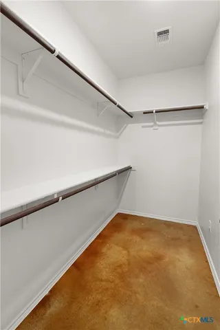 a bathroom with a sink vanity and a mirror