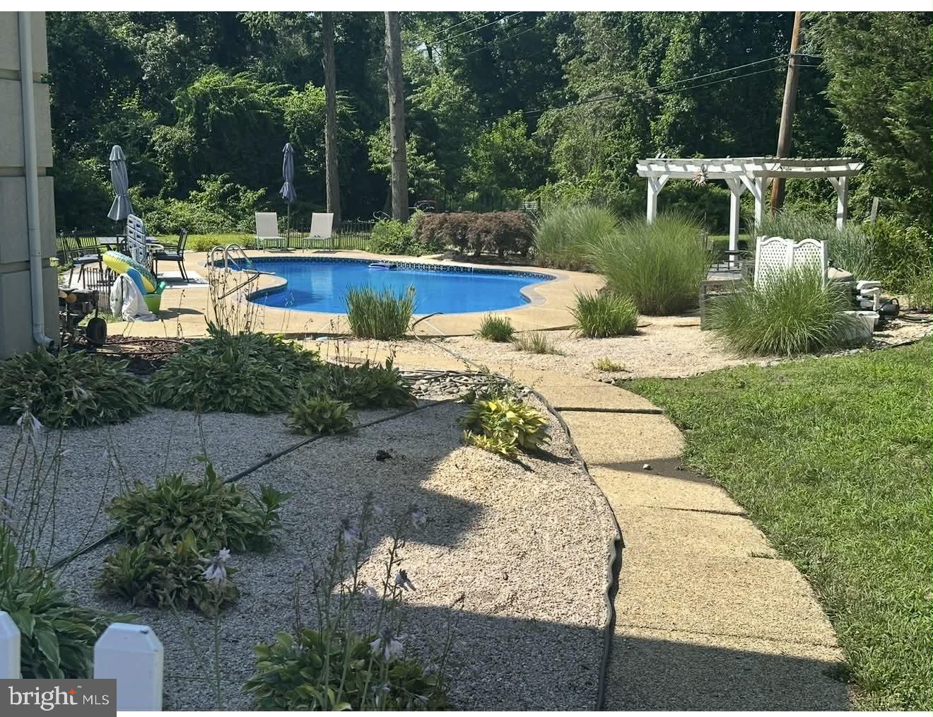 1054 Bayard Road Lothian, MD 20711 - Photo 5 of 6 a view of backyard with swimming pool and outdoor seating