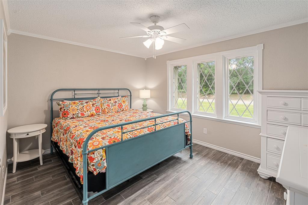 1102 Mill Run Road Athens, TX 75751 - Photo 26 of 35 a bed sitting in a bedroom next to a window