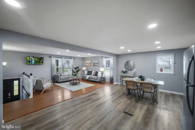 a bedroom with a bed couch and window