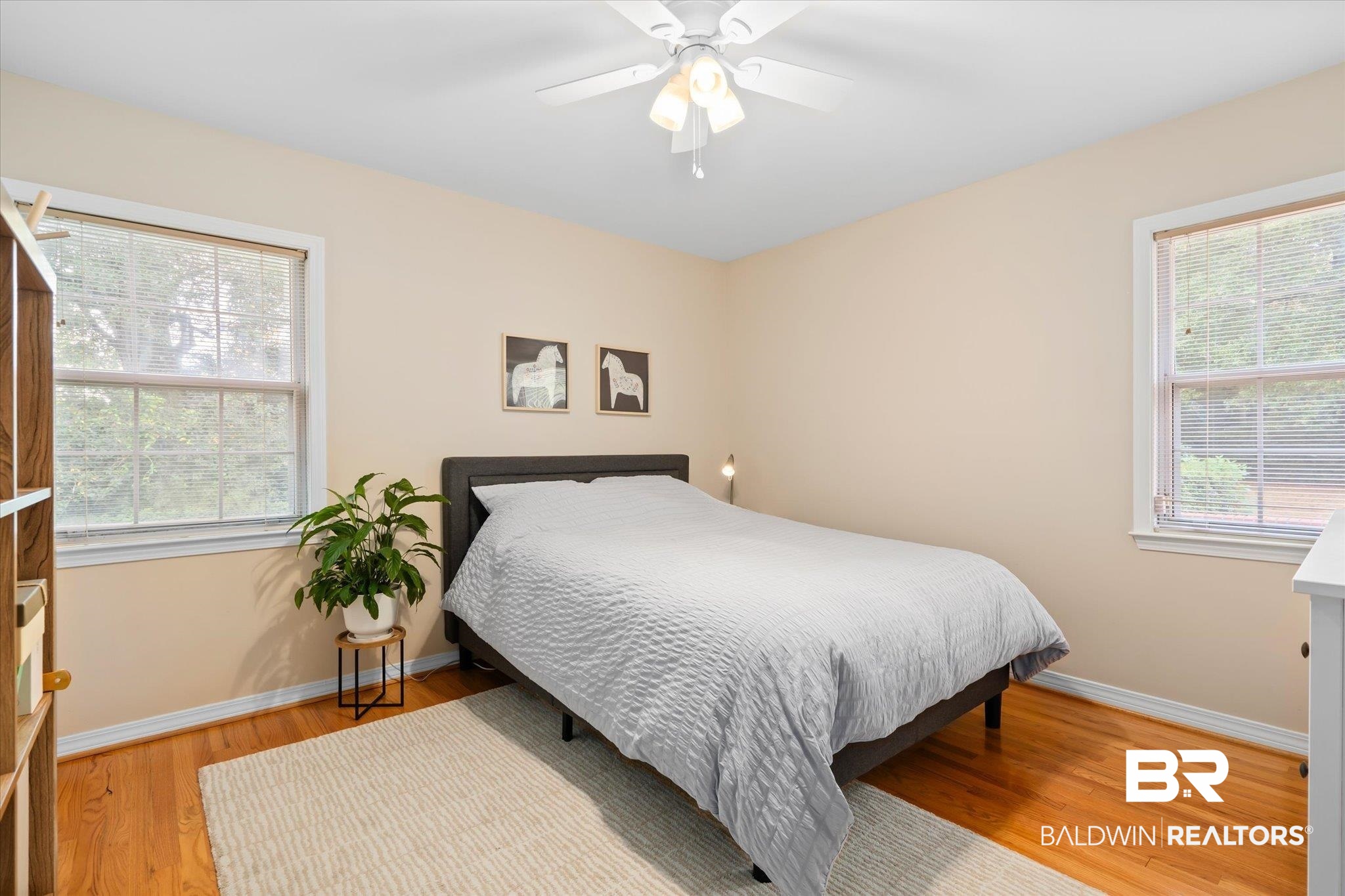 162 Bit And Spur Terrace Mobile, AL 36608 - Photo 15 of 29 Bedroom with multiple windows, light wood-type flooring, and ceiling fan
