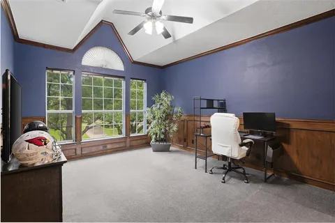 a workspace with furniture and a window
