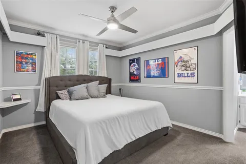 a bedroom with a large bed and a window