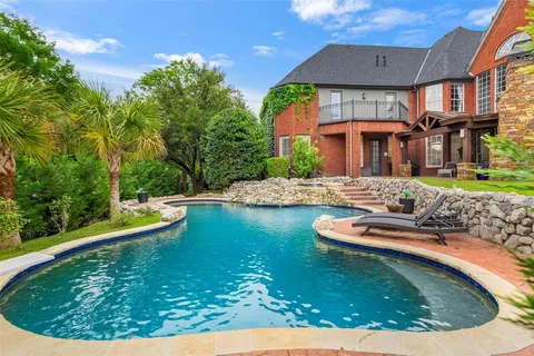a view of a swimming pool with a patio