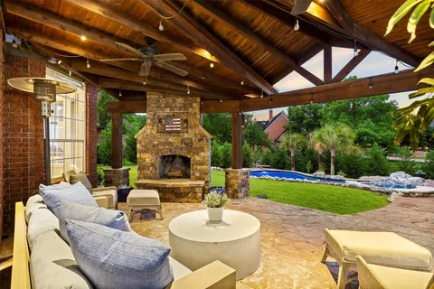 a patio with a table and chairs