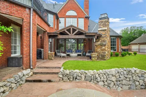 a front view of a house with a garden and pathway