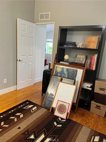 a living room with furniture and flat screen tv