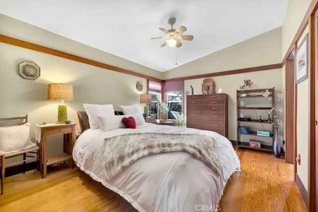 a bed room with a bed and a chandelier