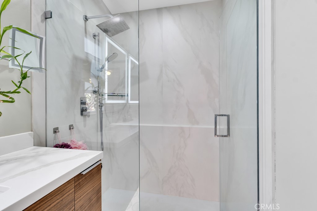 171 Comanche Topanga, CA 90290 - Photo 17 of 54 a bathroom with a sink vanity and shower