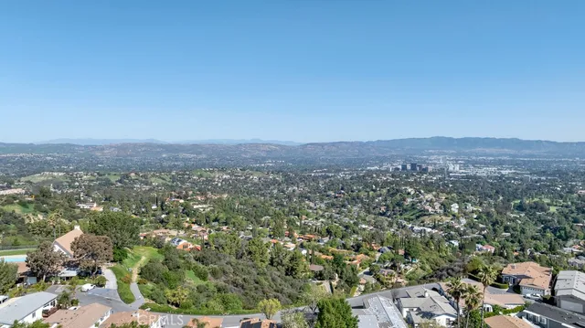 an aerial view of residential house and green space