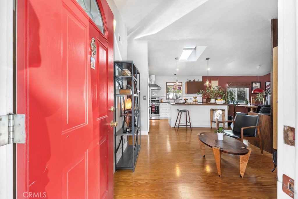 171 Comanche Topanga, CA 90290 - Photo 24 of 54 a dining room with furniture and wooden floor