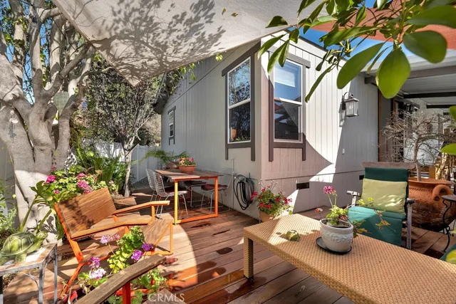a view of a chairs and table in the patio