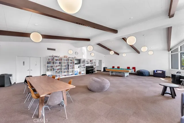 a kitchen with stainless steel appliances and white cabinets