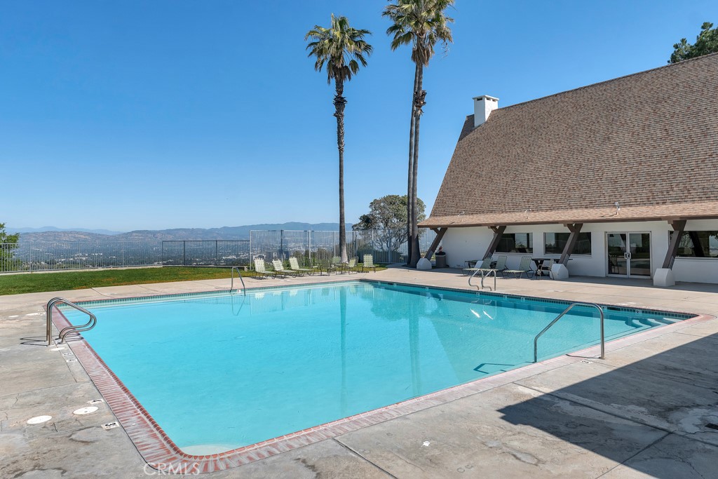 171 Comanche Topanga, CA 90290 - Photo 34 of 54 a view of a swimming pool with a lounge chair