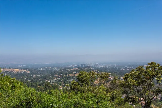 a view of a house with a mountain in the background
