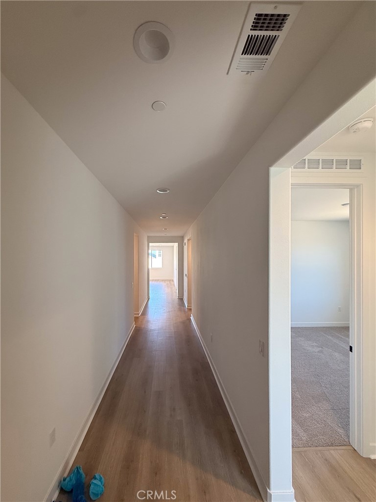 17454 Marion Mountain Hesperia, CA 92345 - Photo 4 of 11 a view of a hallway with wooden floor