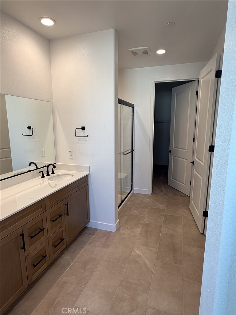 17454 Marion Mountain Hesperia, CA 92345 - Photo 6 of 11 a bathroom with a double vanity sink and mirror