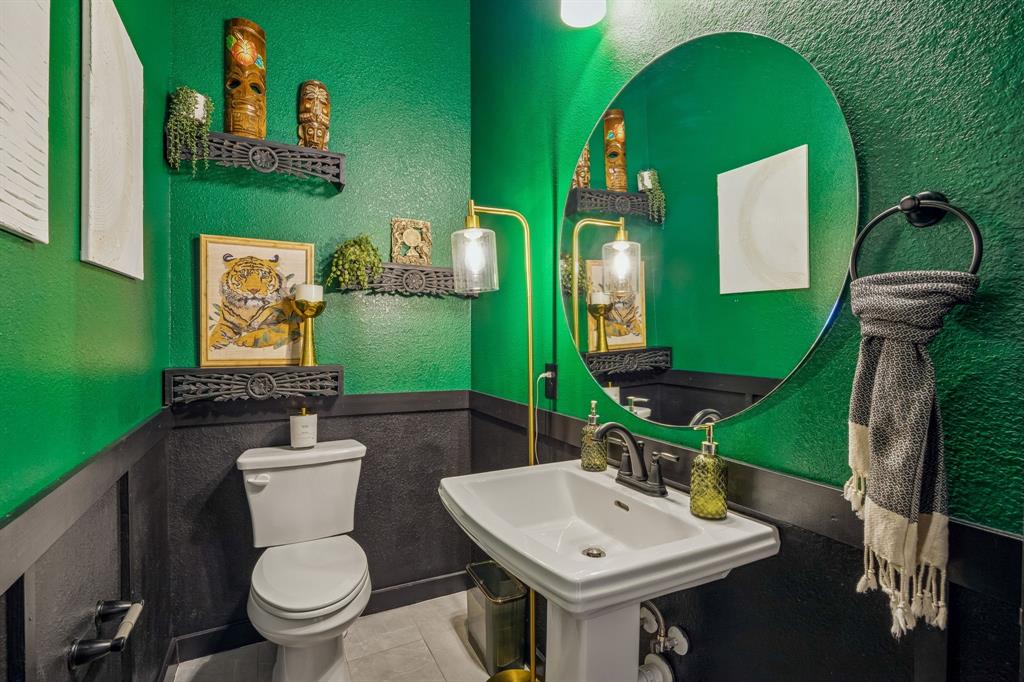 2357 Rook Drive Dallas, TX 75211 - Photo 26 of 28 a bathroom with a sink mirror and toilet