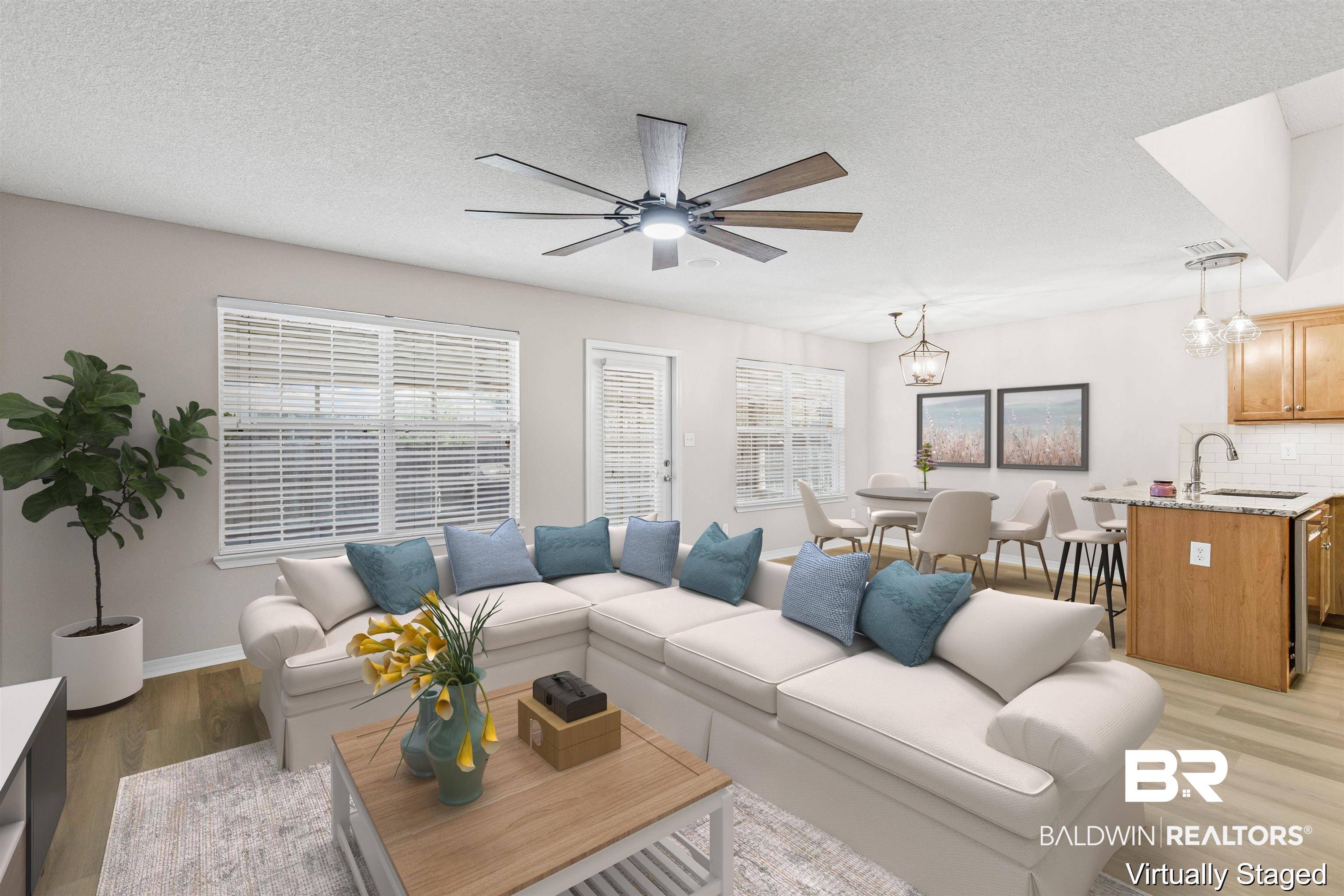 2701 Hampton Park Circle Foley, AL 36535 - Photo 6 of 44 Living room featuring light wood-style flooring, a textured ceiling, a chandelier, and a ceiling fan