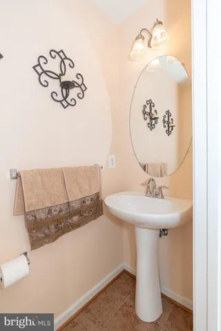 a bathroom with a sink and mirror