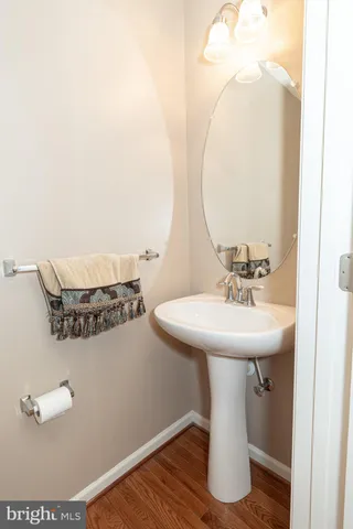a bathroom with a sink and mirror