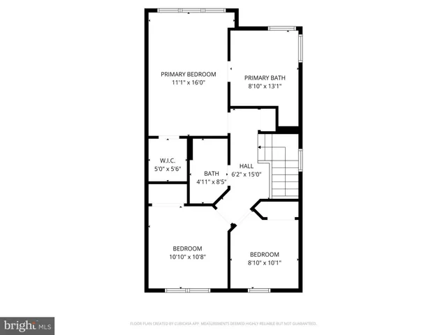 a picture of a bench in front of a wall