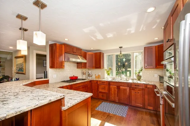 a kitchen with a sink stove and cabinets