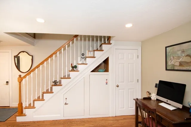 a view of entryway with wooden floor and stairs