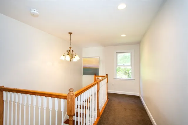 a view of a hallway with windows