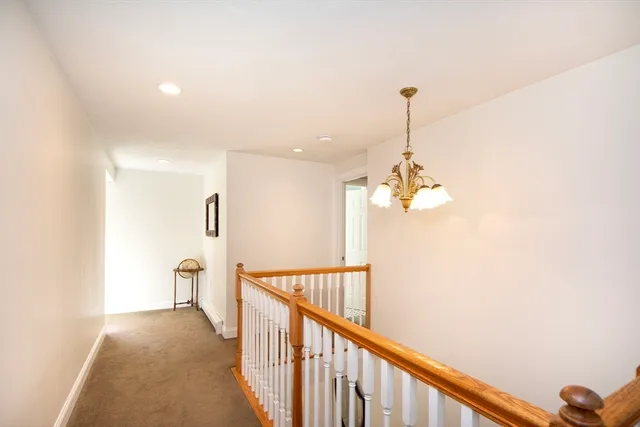 a view of a hallway with stairs