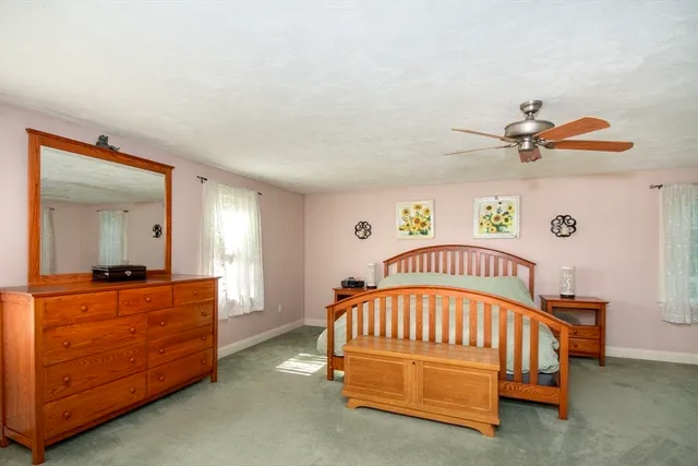 a view of a livingroom with wooden floor and window