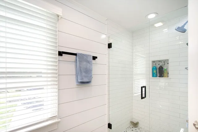 a bathroom with a bathtub and a shower
