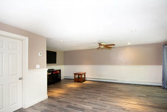 a view of a livingroom with wooden floor