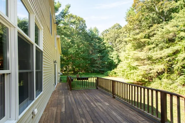 a view of balcony with wooden floor