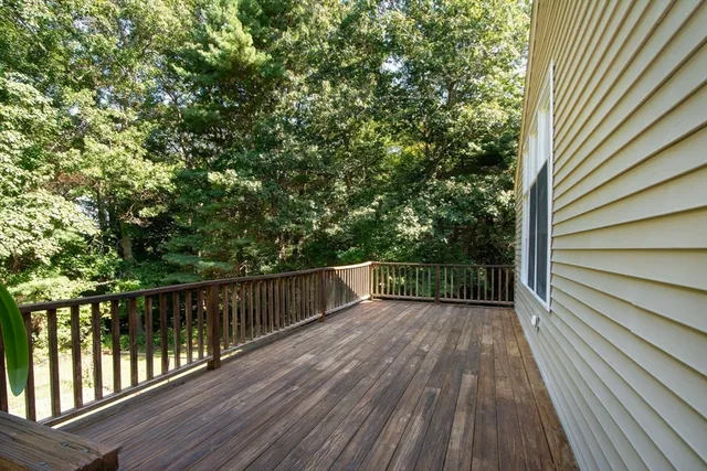 a view of a balcony with wooden floor